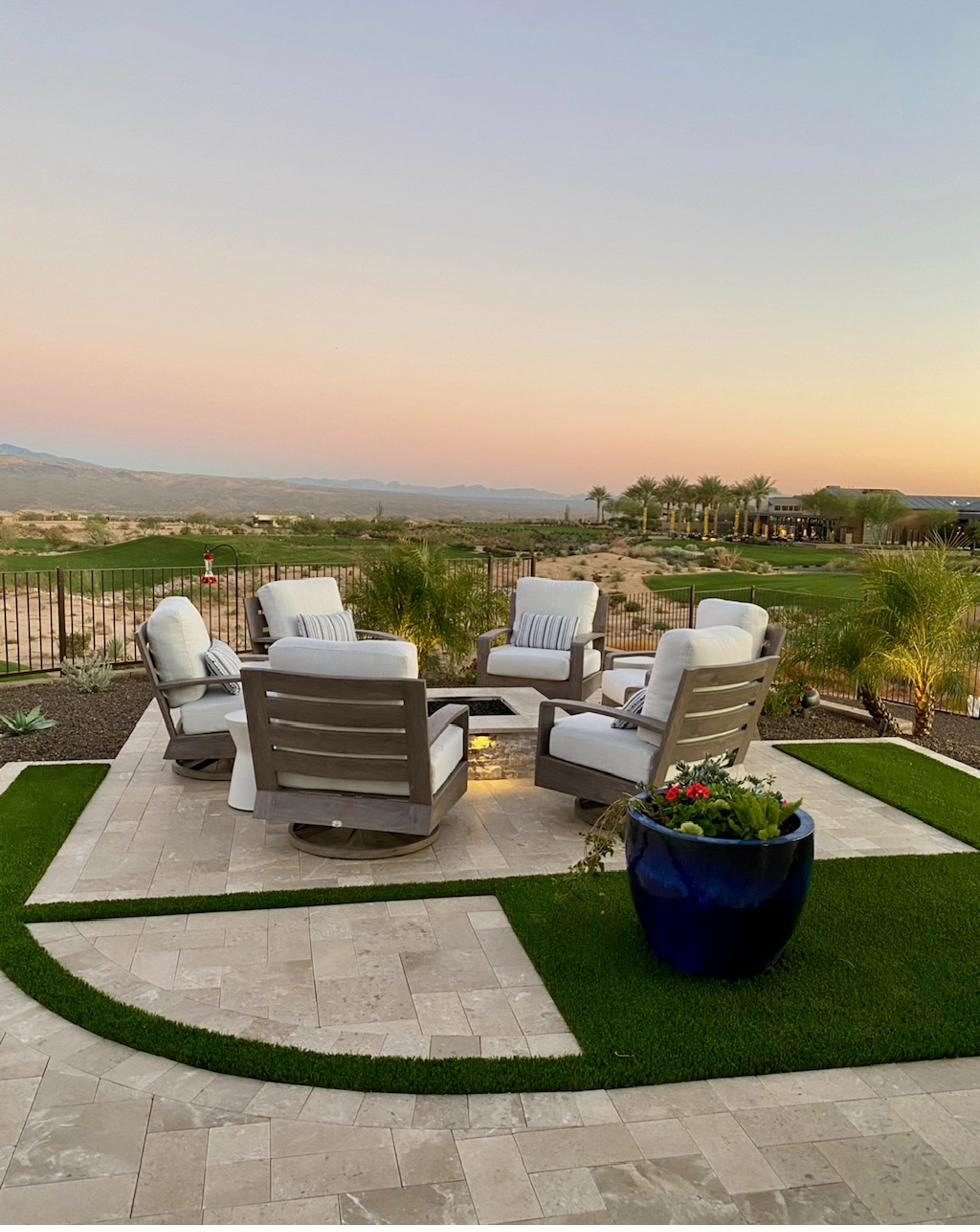 Restored outdoor lounge chairs around a fire pit at golden hour in the Arizona desert