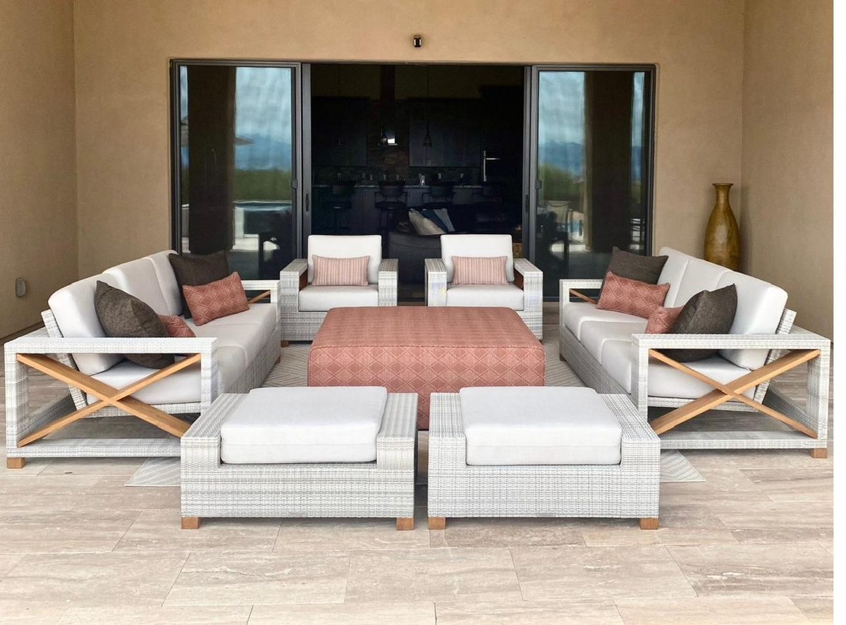 Restored white outdoor cushions on a luxury patio set